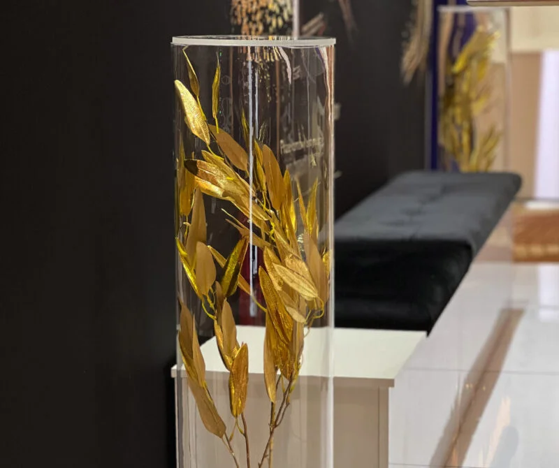 golden leaves in a glass tube