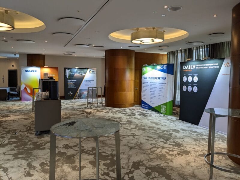 Modular hotel booth with branding Compact hotel booth with counter and graphic wall, ideal for conferences