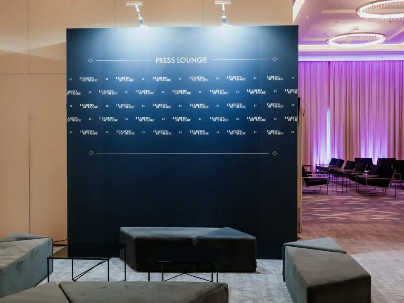 Seamless navy press wall with printed branding