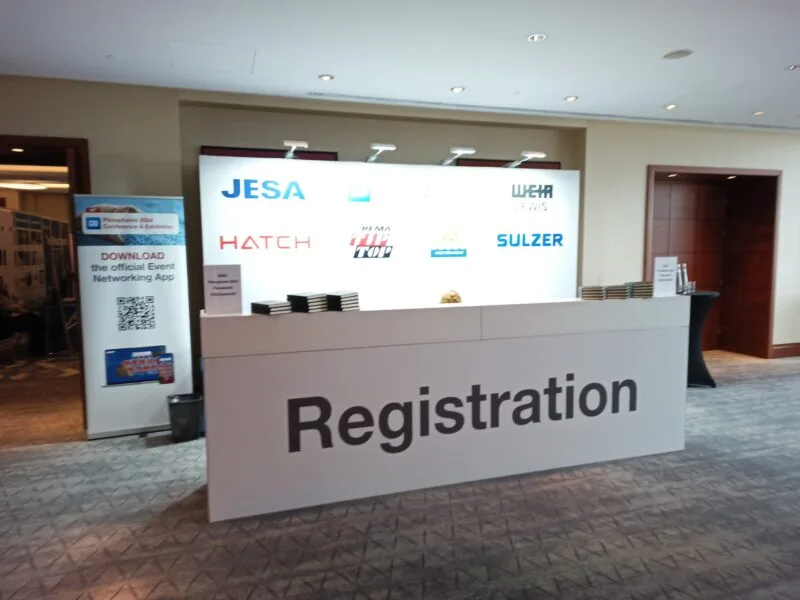 Printed reception desk with Registration branding