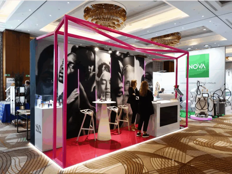 premium trade show booth with backlit walls and bold frame design